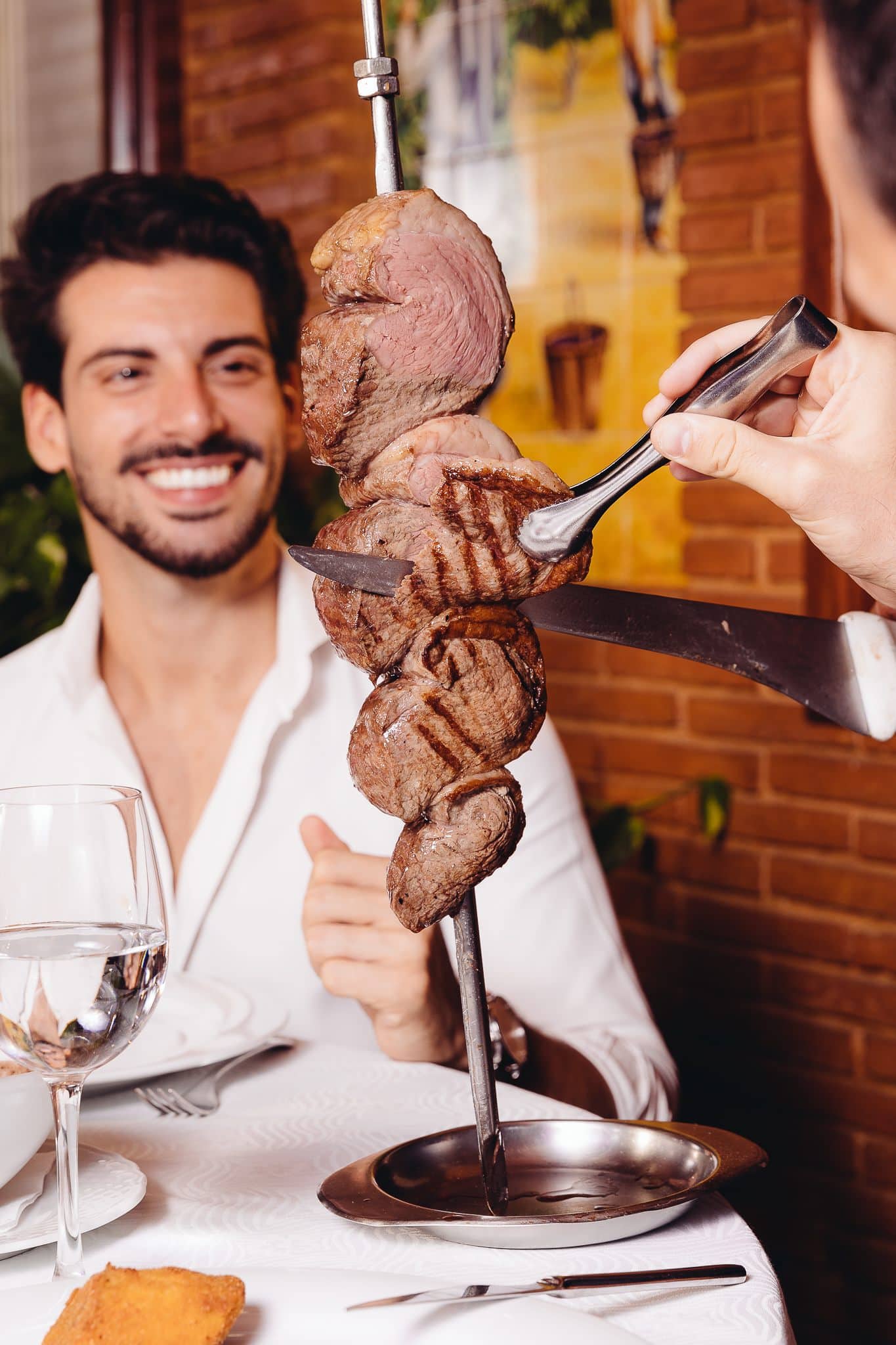 Tableside picanha service at Restaurante Figueiral.